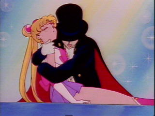 sailor moon is dying, but tuxedo kamen saves her..